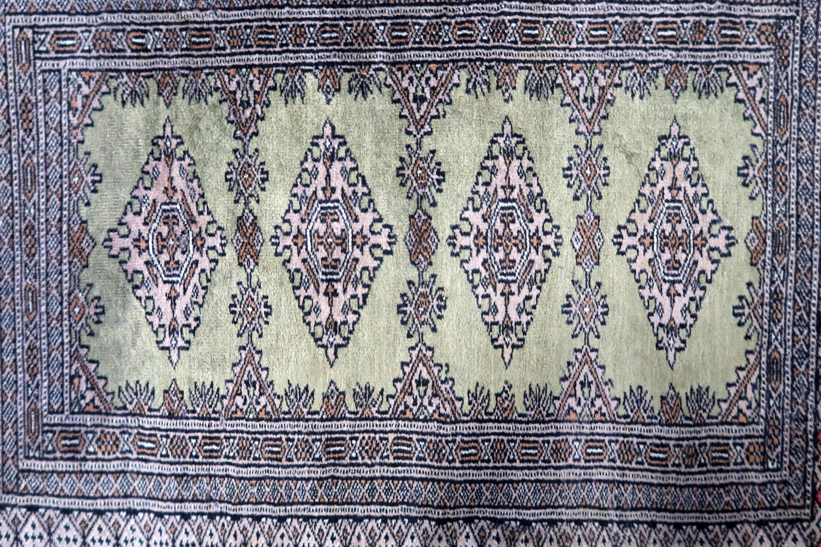 Full view of vintage Bukhara carpet

