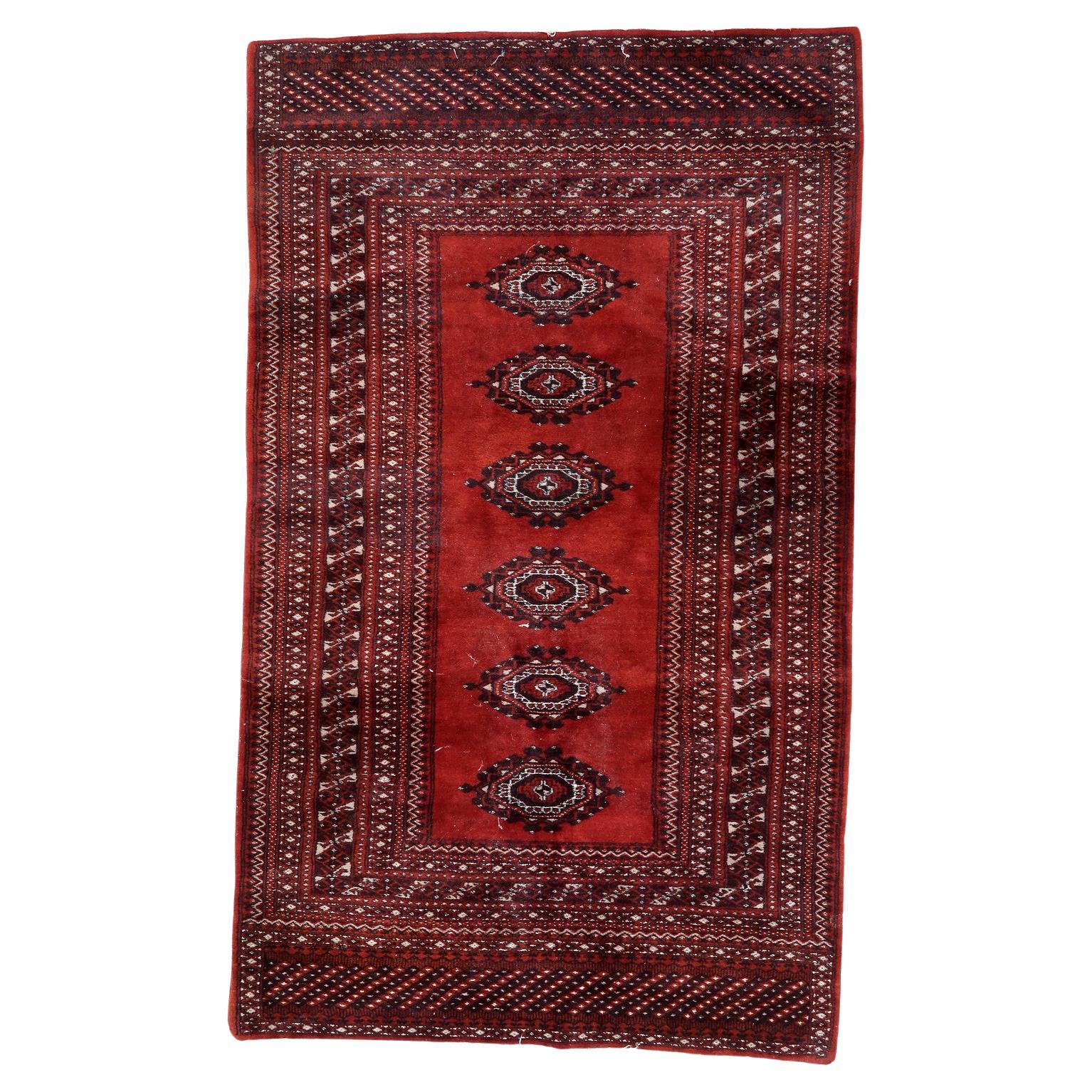 Vintage Uzbek Bukhara rug with elephant’s foot motifs


