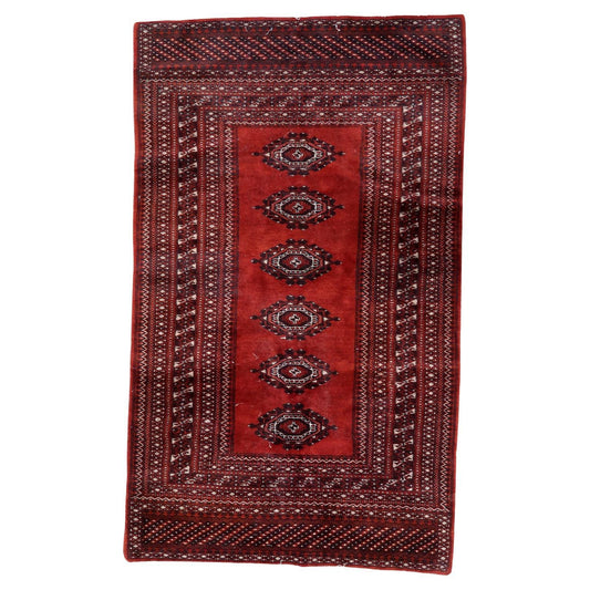 Vintage Uzbek Bukhara rug with elephant’s foot motifs

