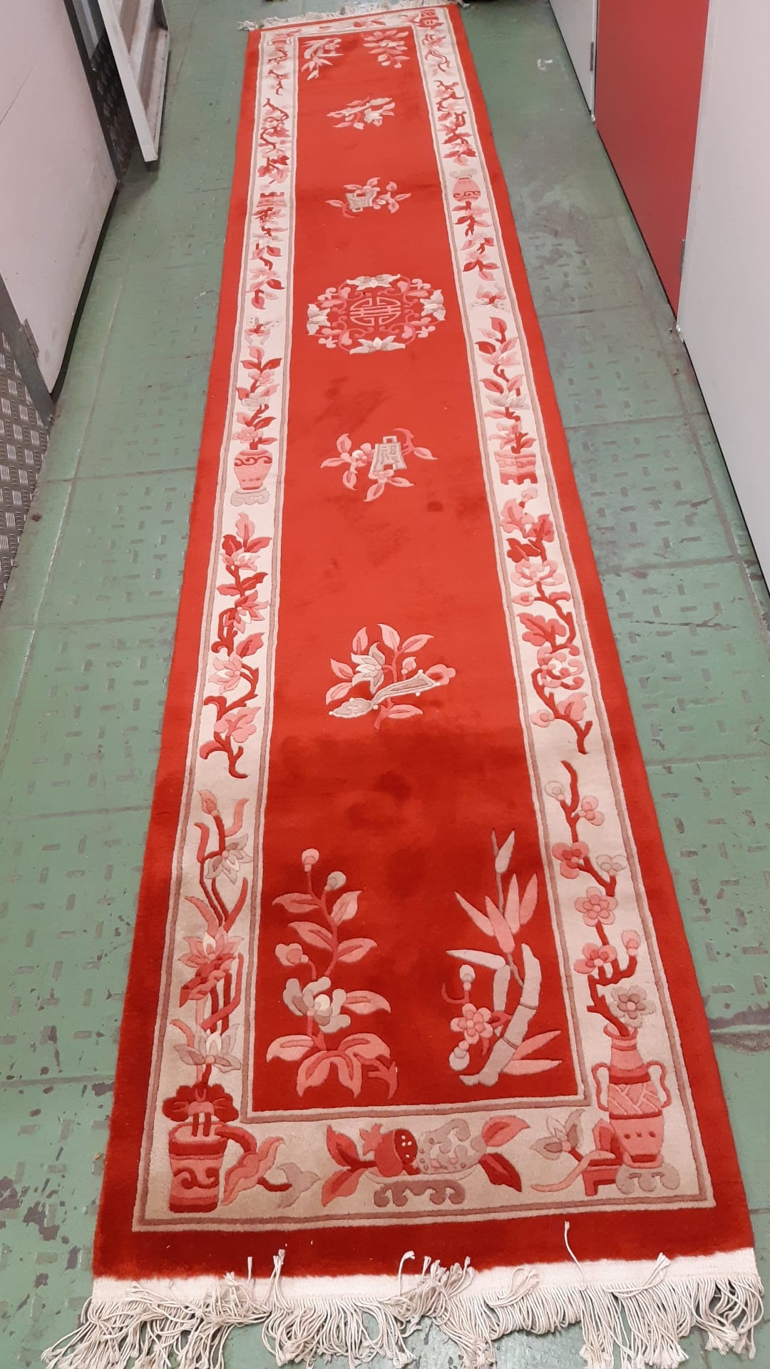 Runner rug with intricate floral motifs and bold colors
