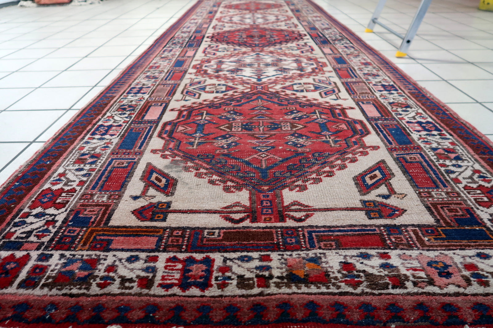Traditional handwoven Persian rug with a warm and elegant color palette
