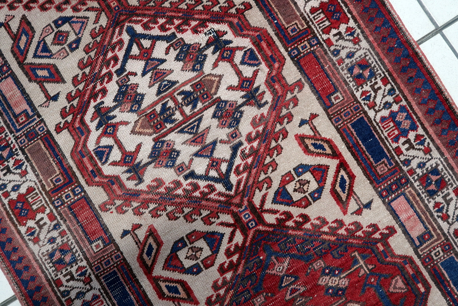Antique Persian Serab rug with symmetrical multi-layered border design
