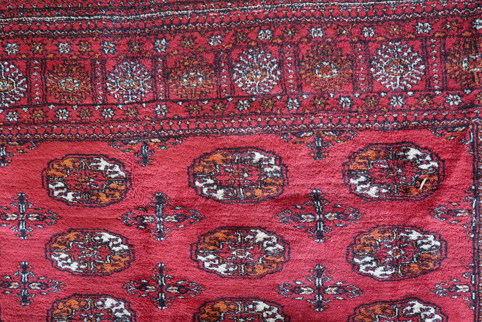 Vintage Ersari rug with geometric patterns
