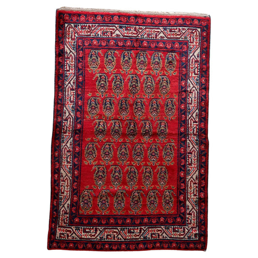 Full top view of the vintage Persian Hamadan rug showing its complete repeating medallion pattern.

