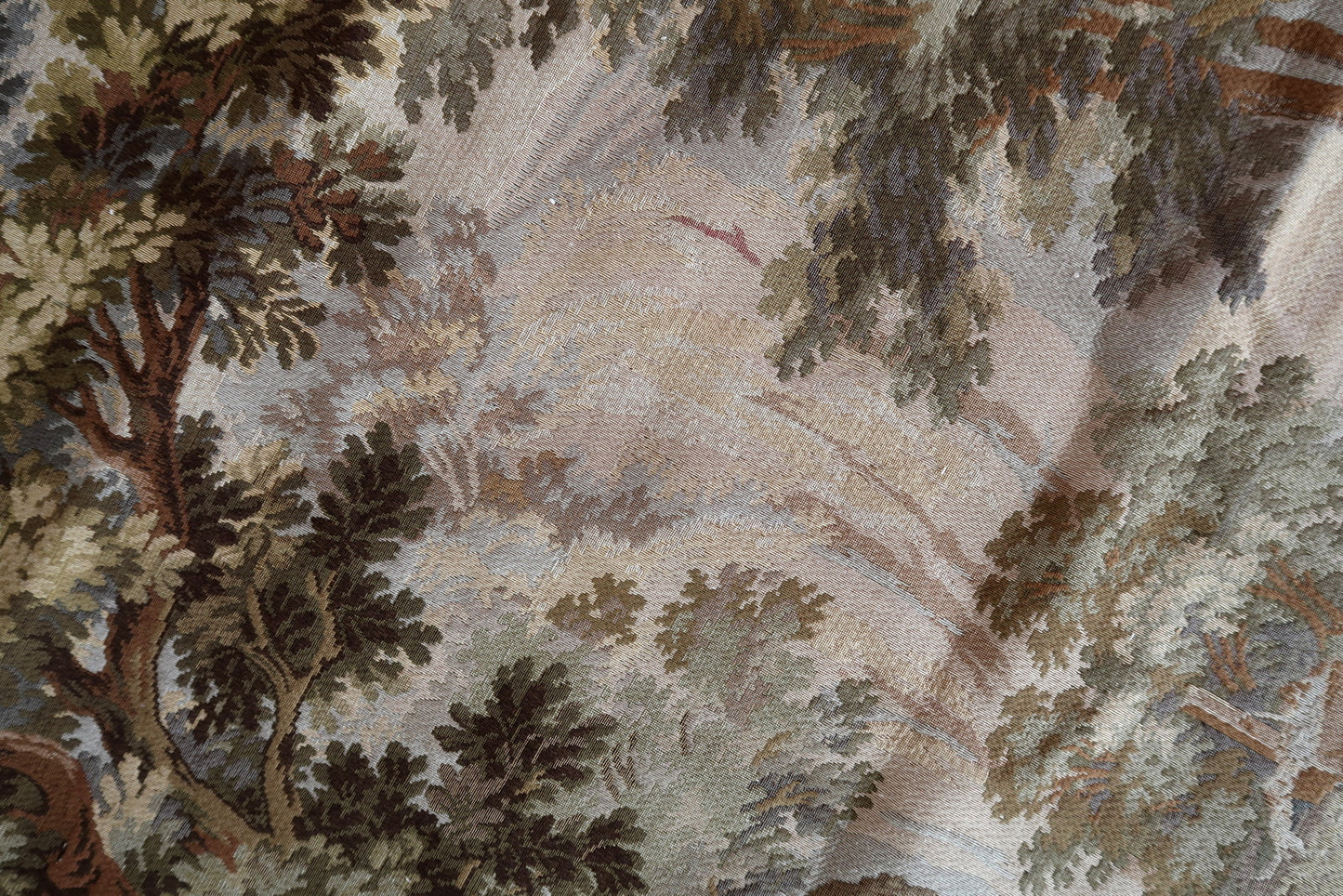 Top section of the tapestry showing the mature forest canopy.

