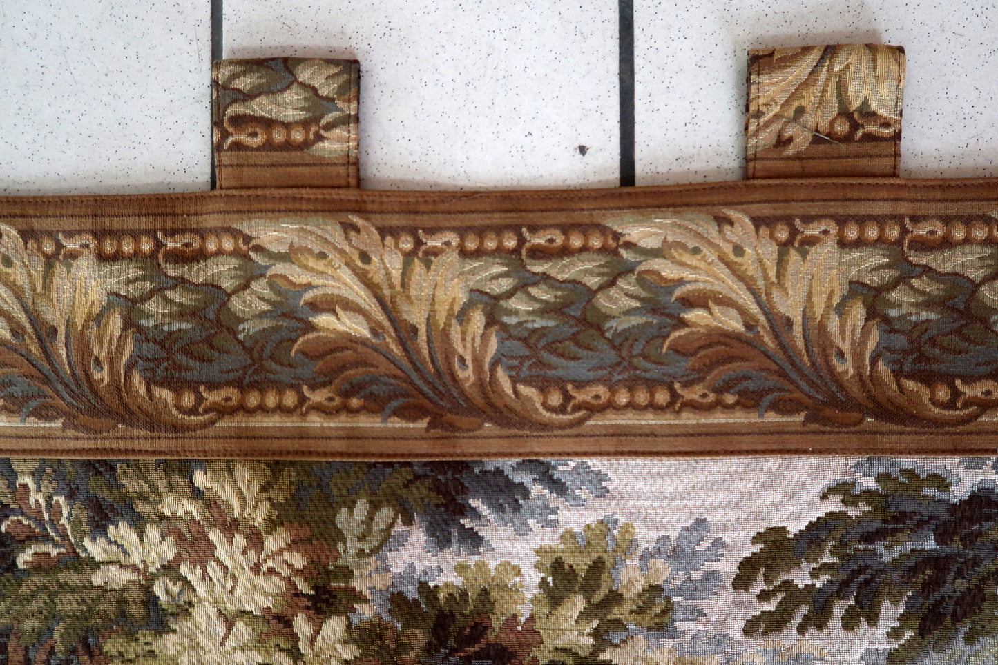 Earthy color palette of brown, beige, and green in the scene.

