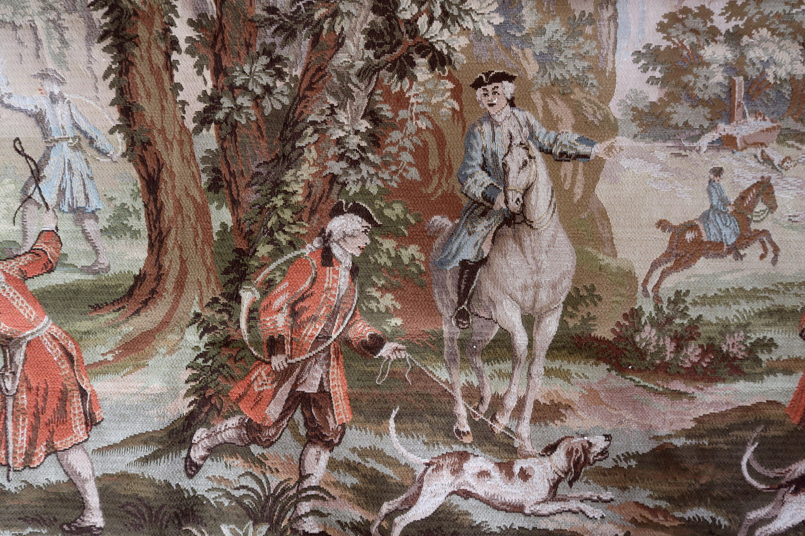 Detailed view of the hunting dogs and foliage in deep green.


