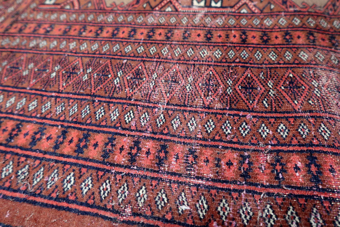 Top-down photograph capturing the rug's balanced pattern repetition.

