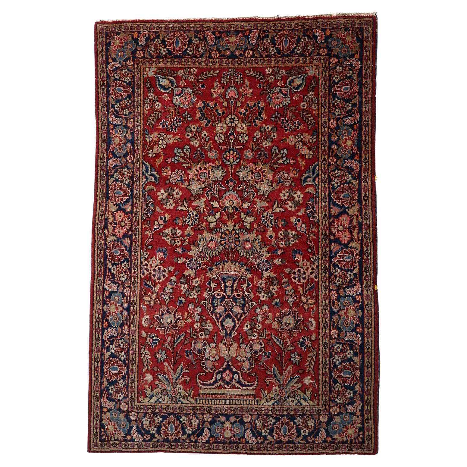 Antique Persian Kashan rug with a central Tree of Life design.

