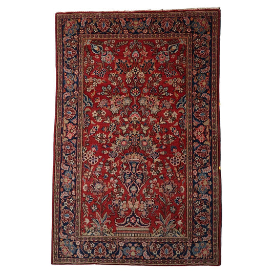 Antique Persian Kashan rug with a central Tree of Life design.

