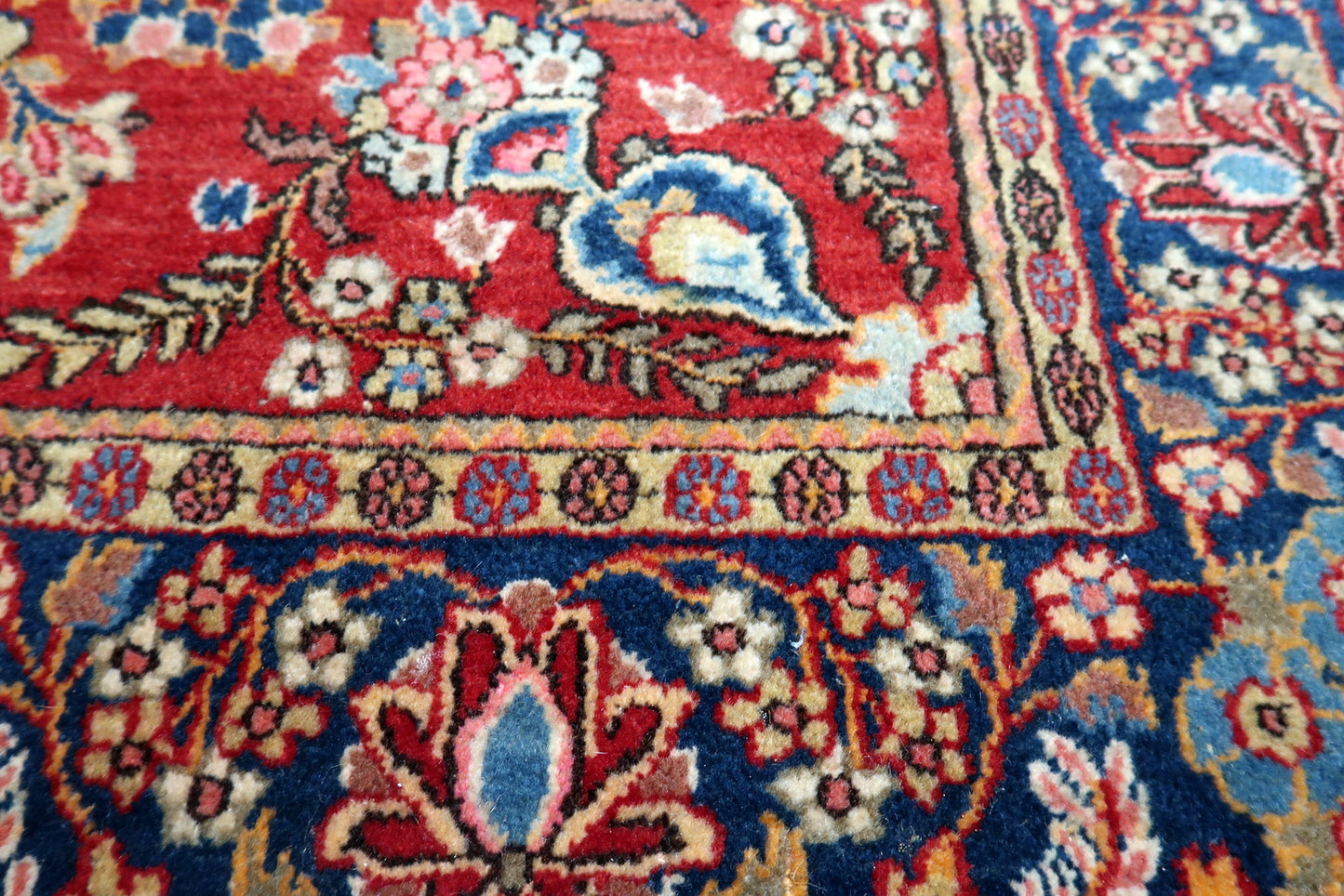 Contrast between the brick red field and navy blue border.

