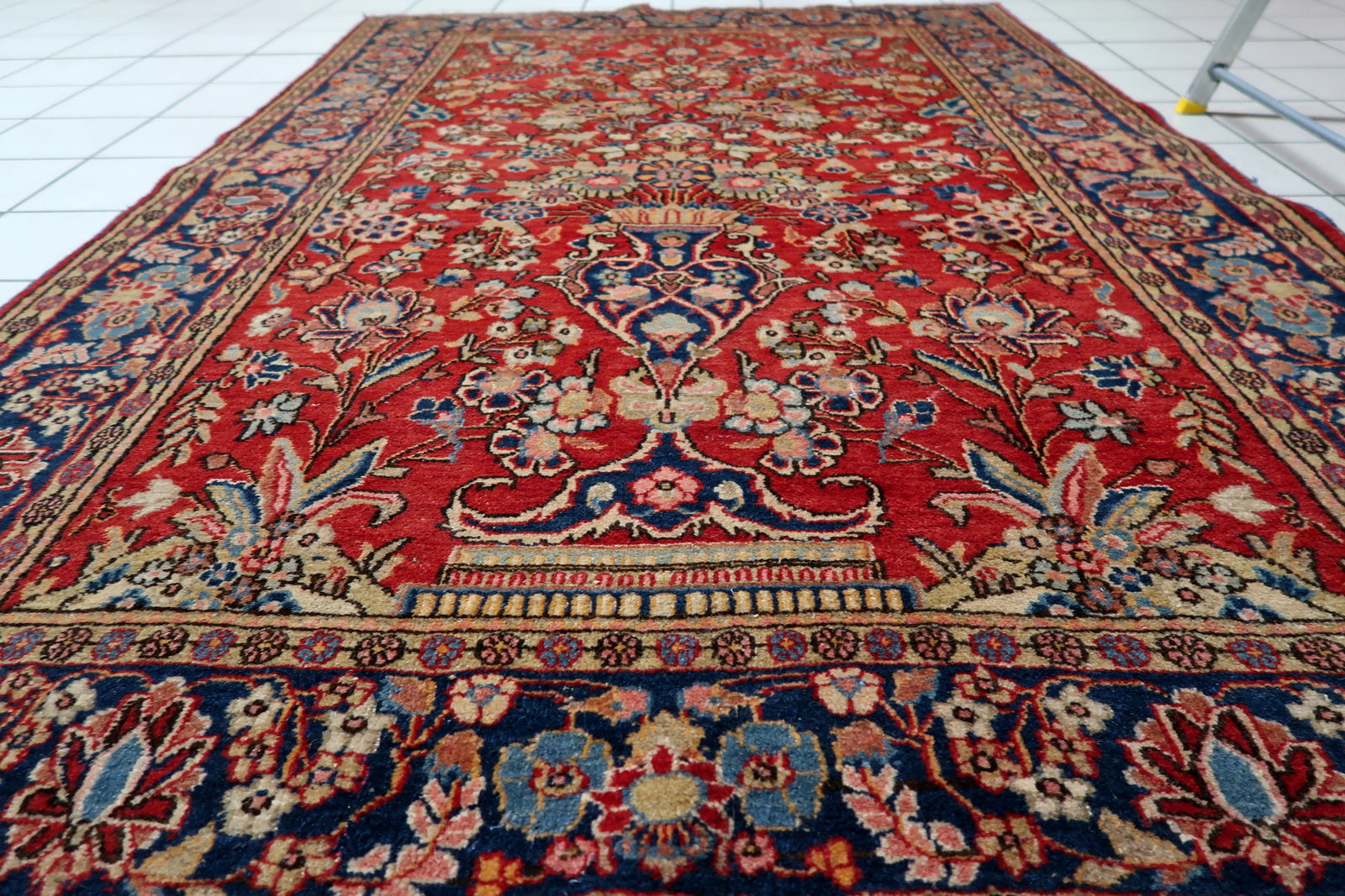 Gold and terracotta highlights woven into the botanical motifs.

