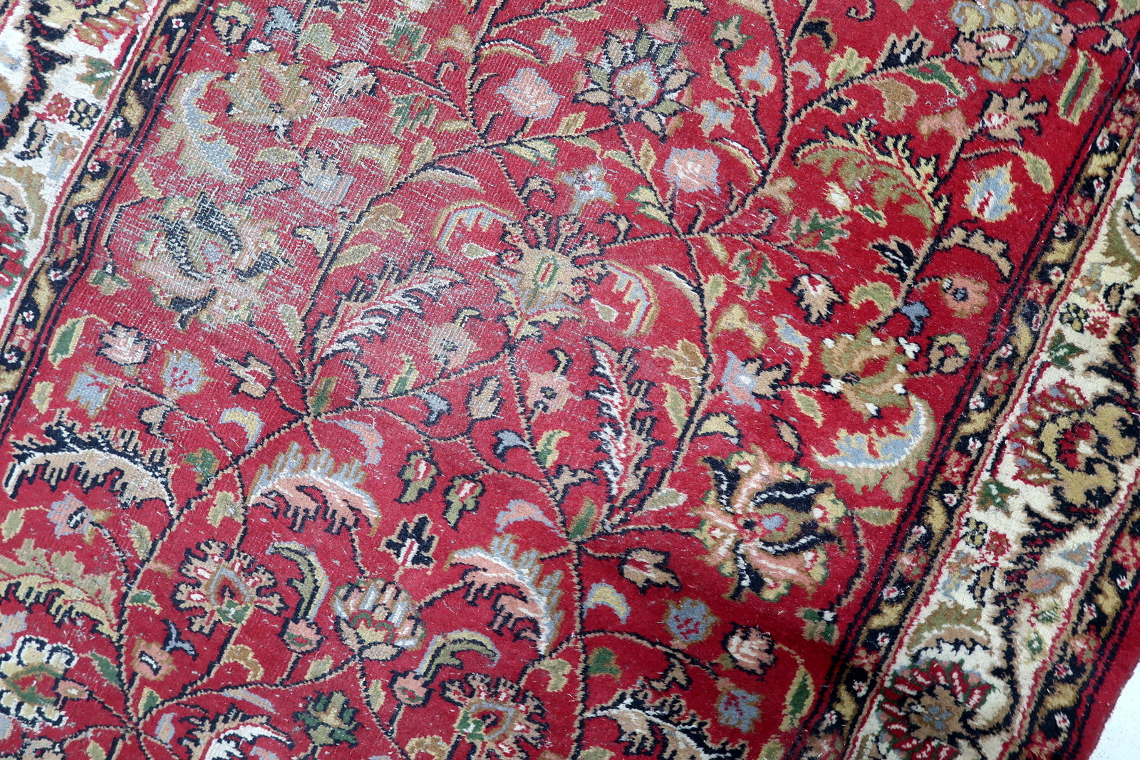 Contrast between warm red field and dark blue patterns

