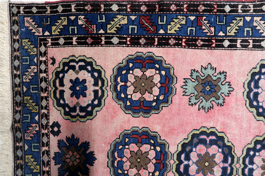 Close-up of navy blue floral medallion with intricate details

