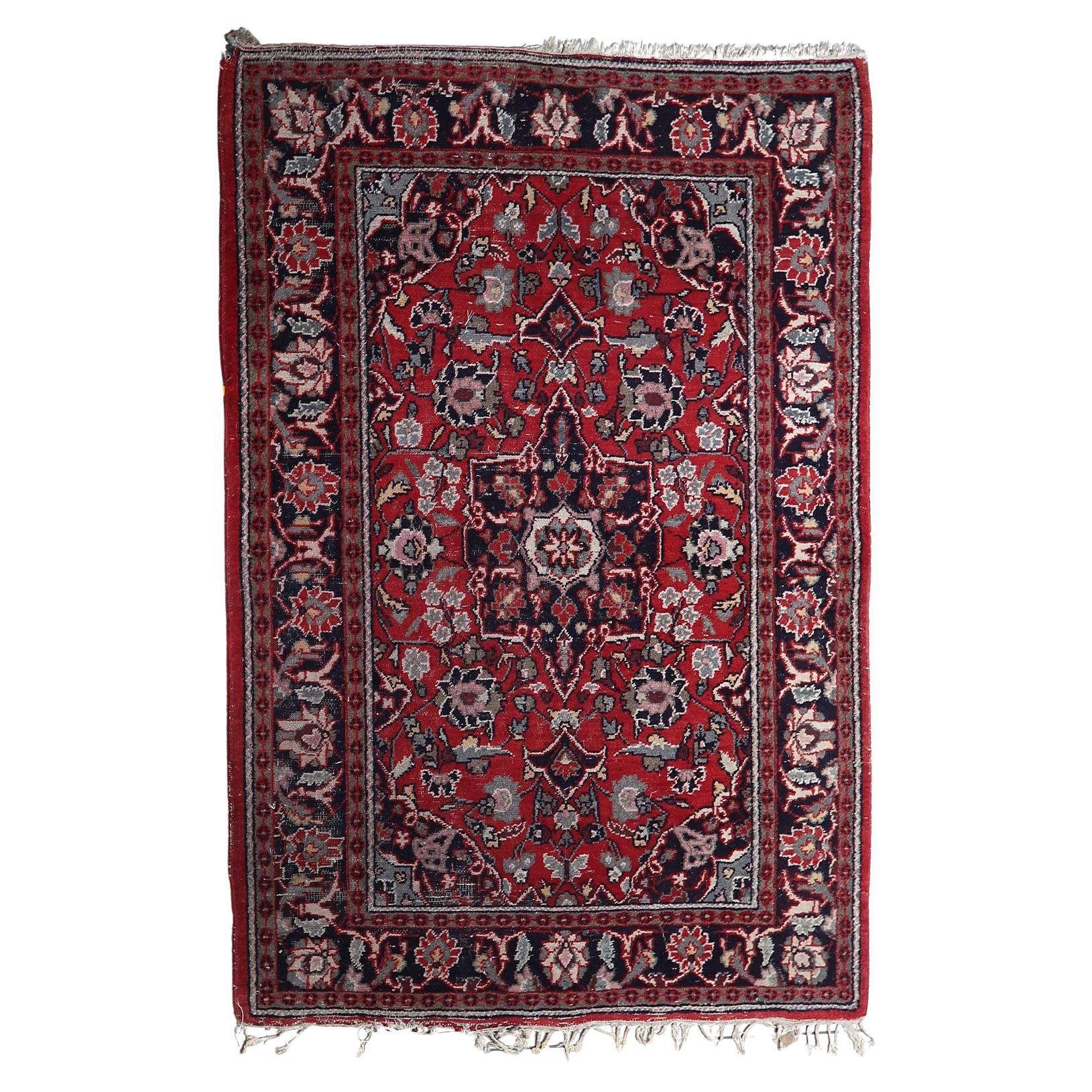Vintage Hamadan rug with deep red field and central medallion

