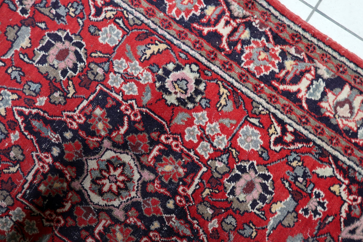 Detailed view of intricate floral motifs in the central design

