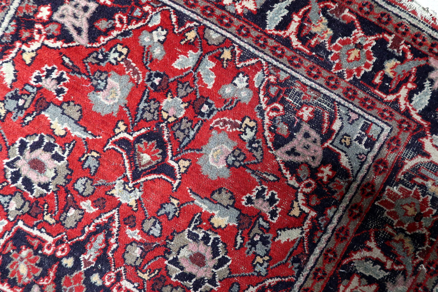 Contrast between red field and navy blue geometric elements

