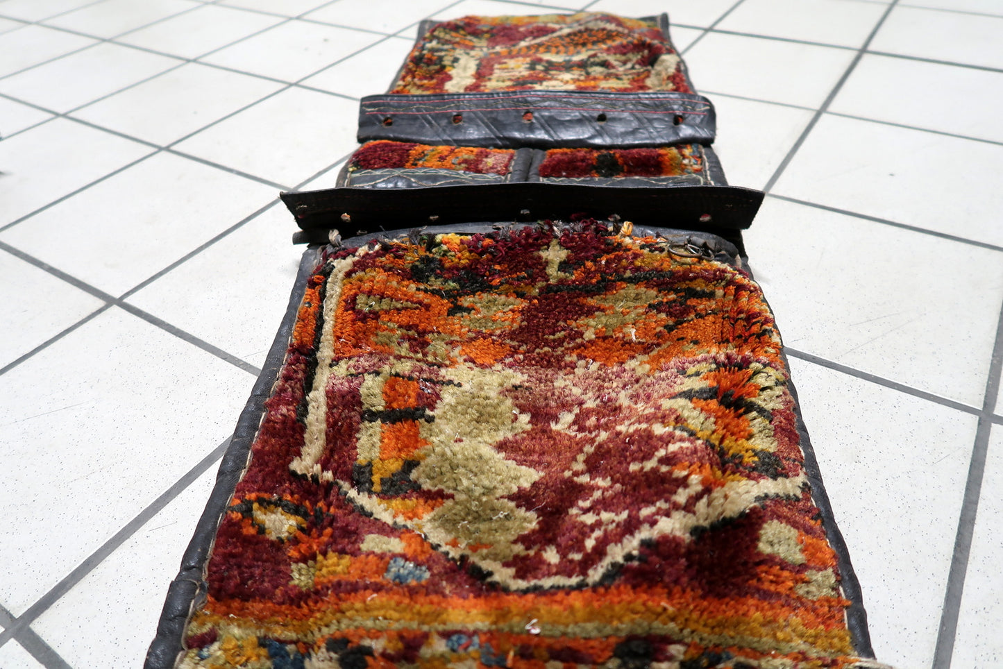 Rich burgundy background of the nomadic weaving

