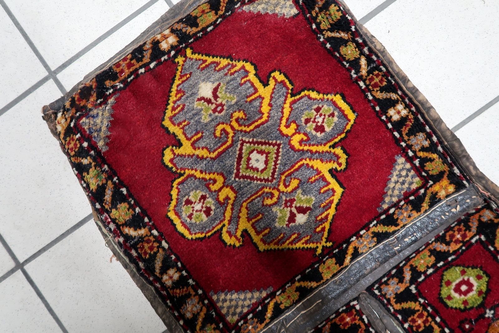 Geometric tribal medallions on rich red background

