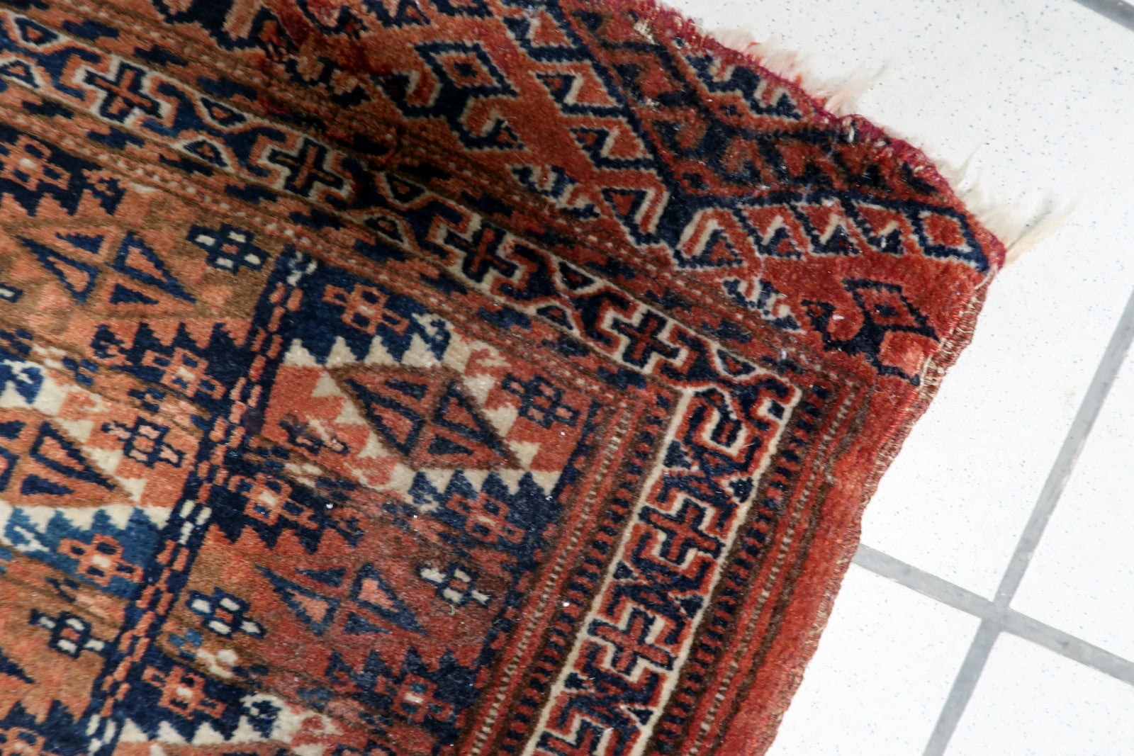 Dense hand-knotted wool weaving showing texture

