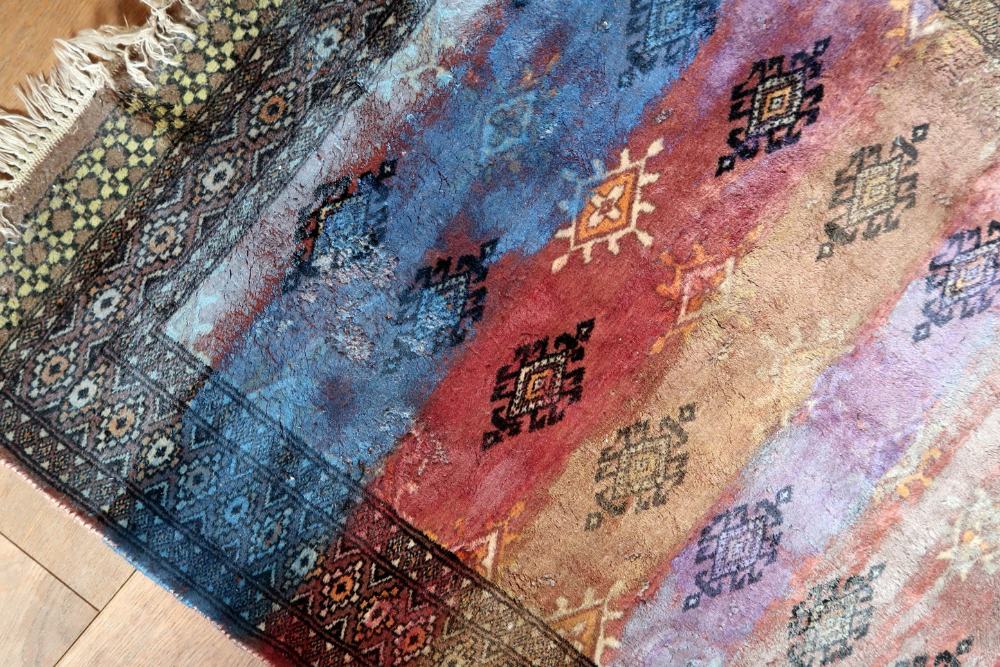Close-up of fabric paint texture on wool pile surface

