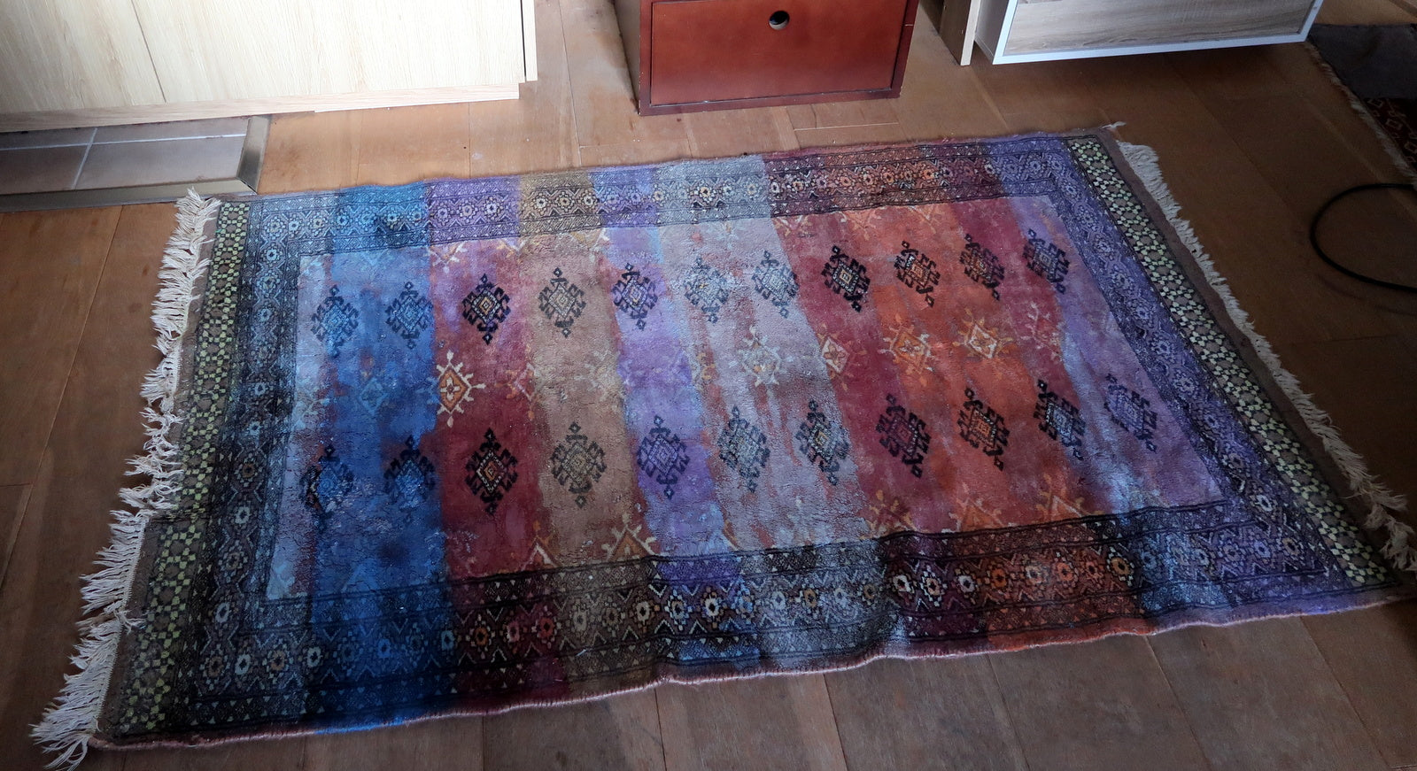 Blue color wash over underlying Bukhara motifs

