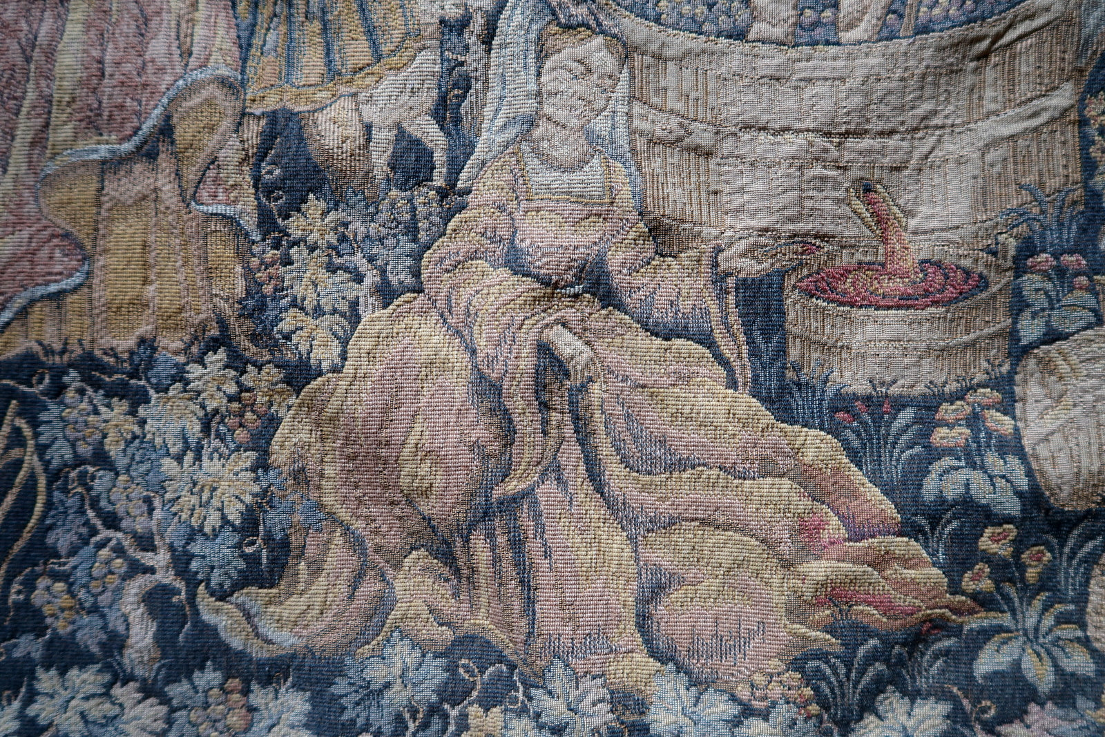 Close-up of central grape treading in wooden barrel

