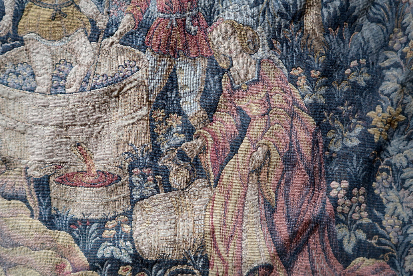 Muted blue and terracotta tones in vintage tapestry


