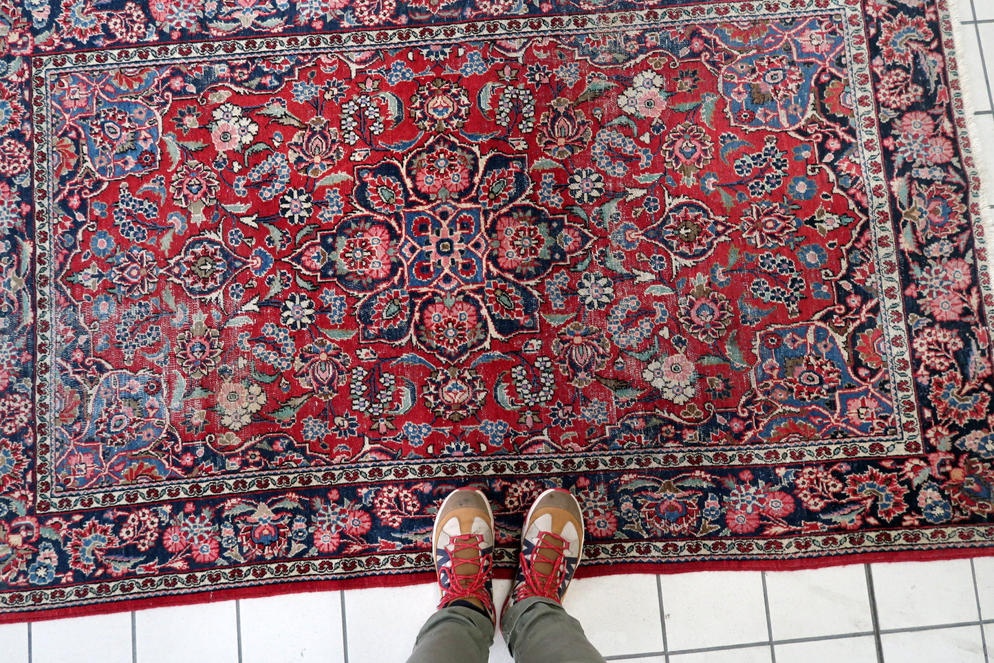 Close-up on the soft green and pale blue accents within the floral design.

