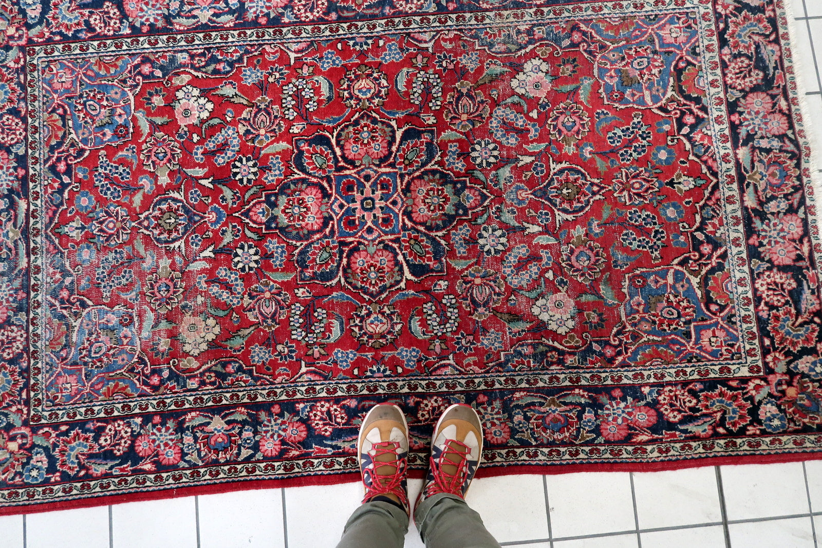 Close-up on the soft green and pale blue accents within the floral design.

