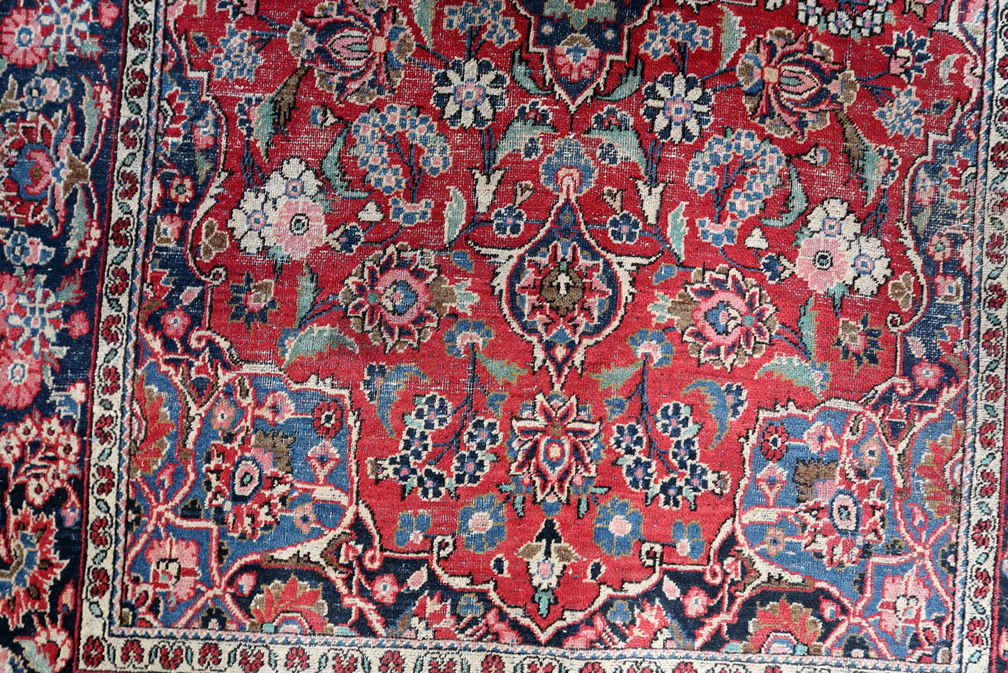 Detail of the contrasting indigo blue motifs and creamy ivory accents.

