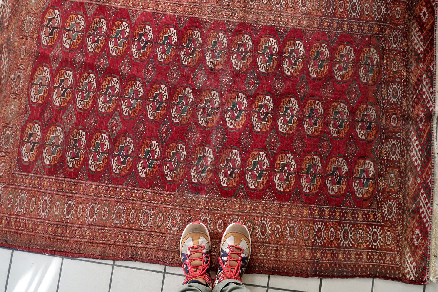A section of the rug showcasing the rhythmic repetition of the gul pattern.

