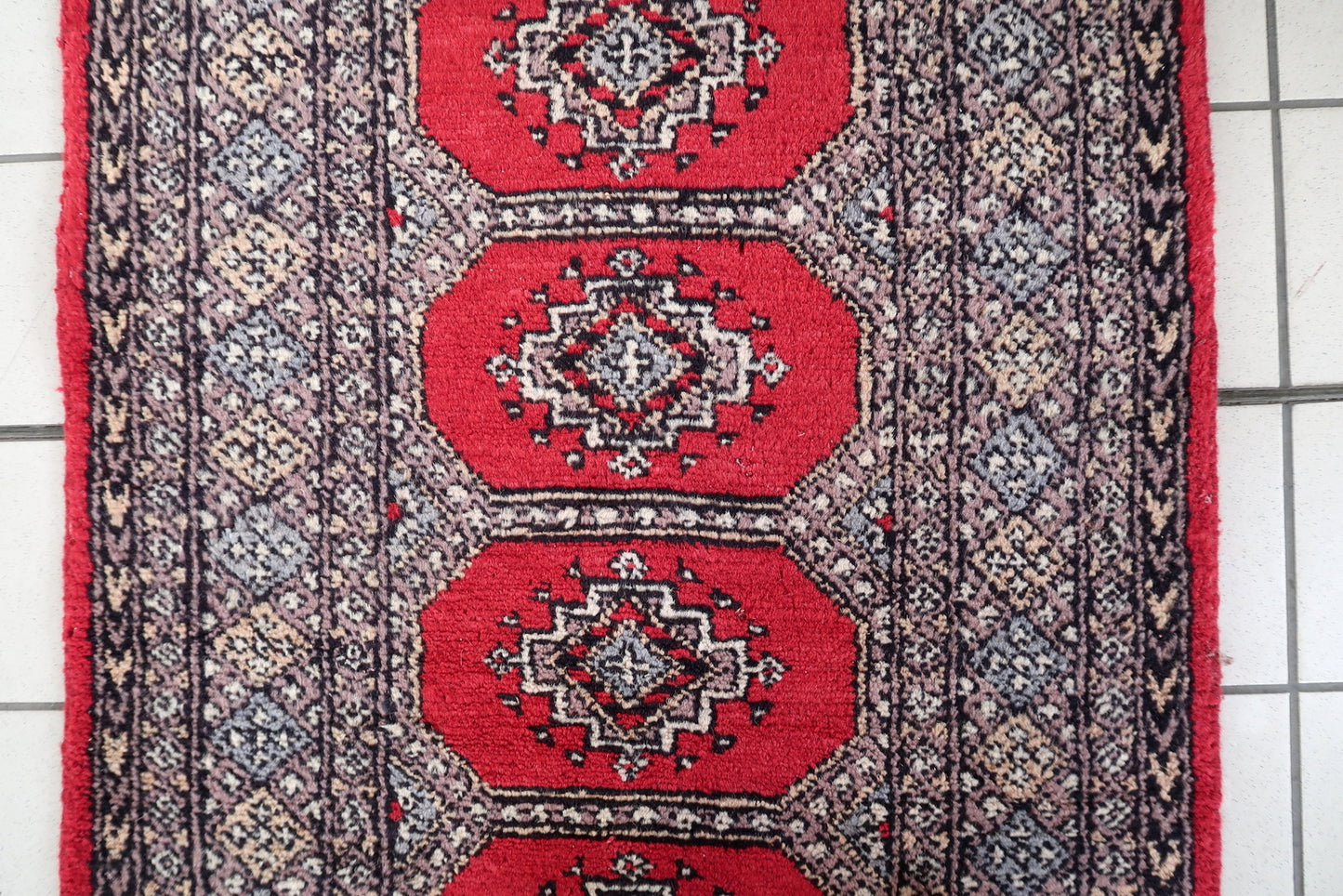 Detail of the deep navy blue elements within the gul motifs.

