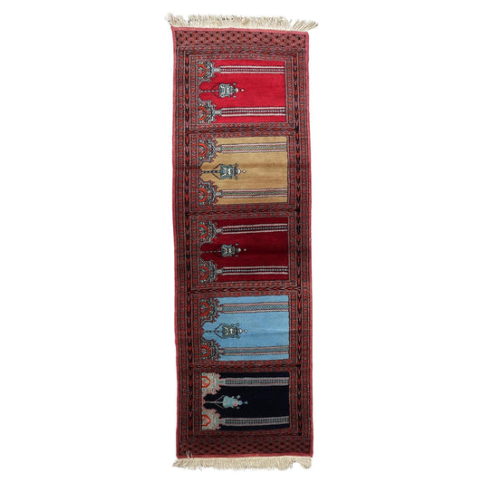 Full top view of the vintage Bukhara runner showing the complete multi-niche design.

