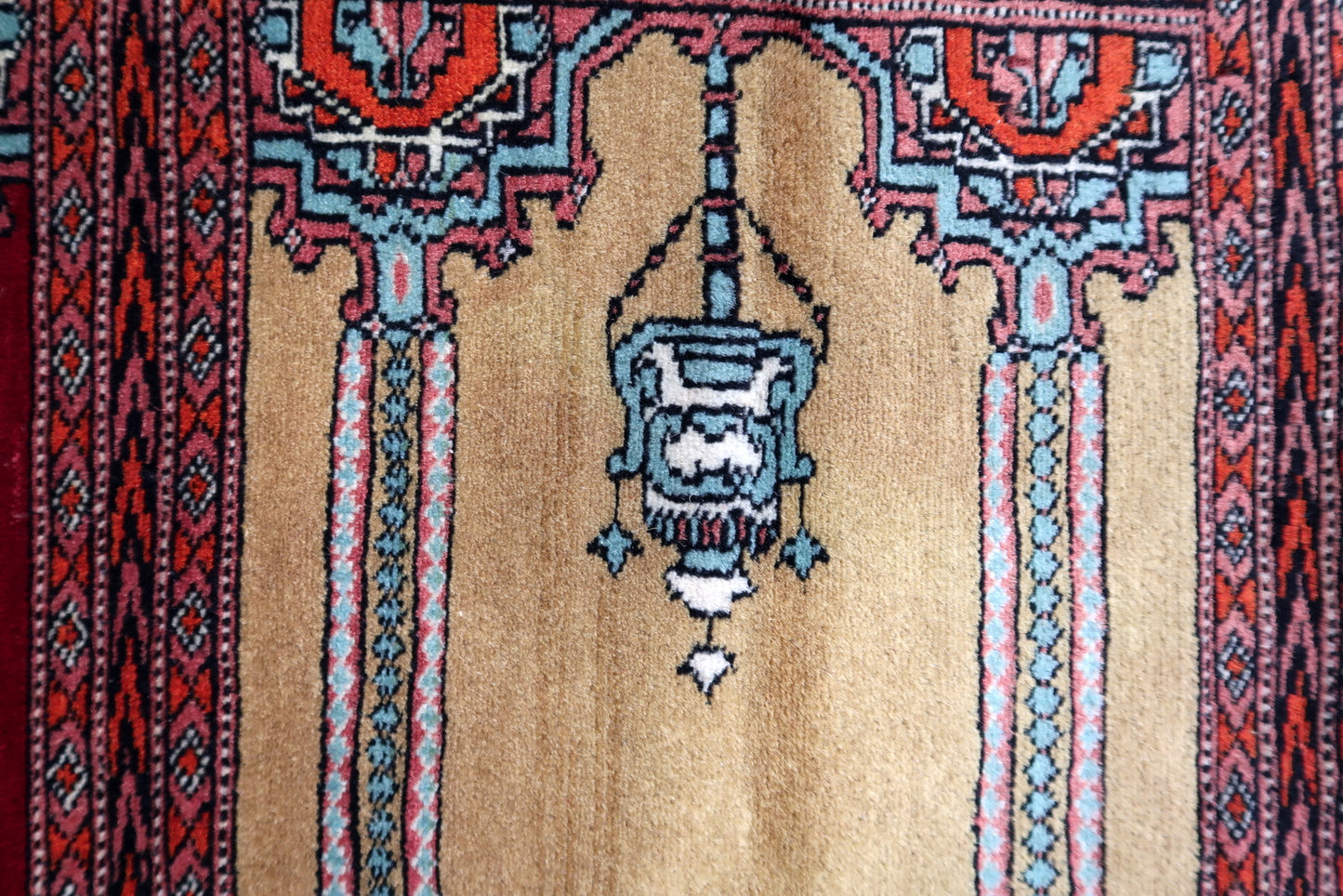 View highlighting the contrast between the red field and blue/black accents.

