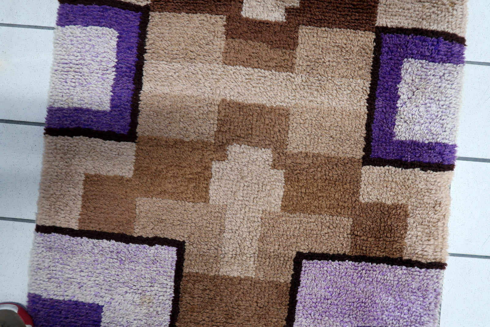 Detail of the layered, rhythmic design guiding the eye along the runner's length.

