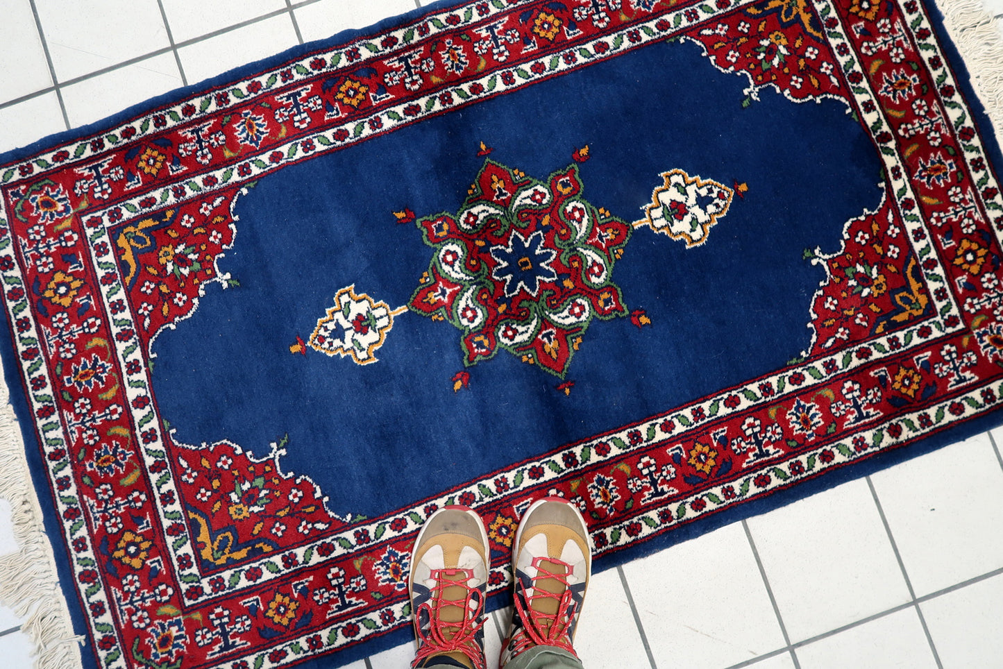 A section of the rug showcasing the painterly quality and artistry.

