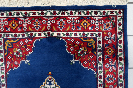 Close-up detail of the delicate floral patterns and curvilinear motifs.

