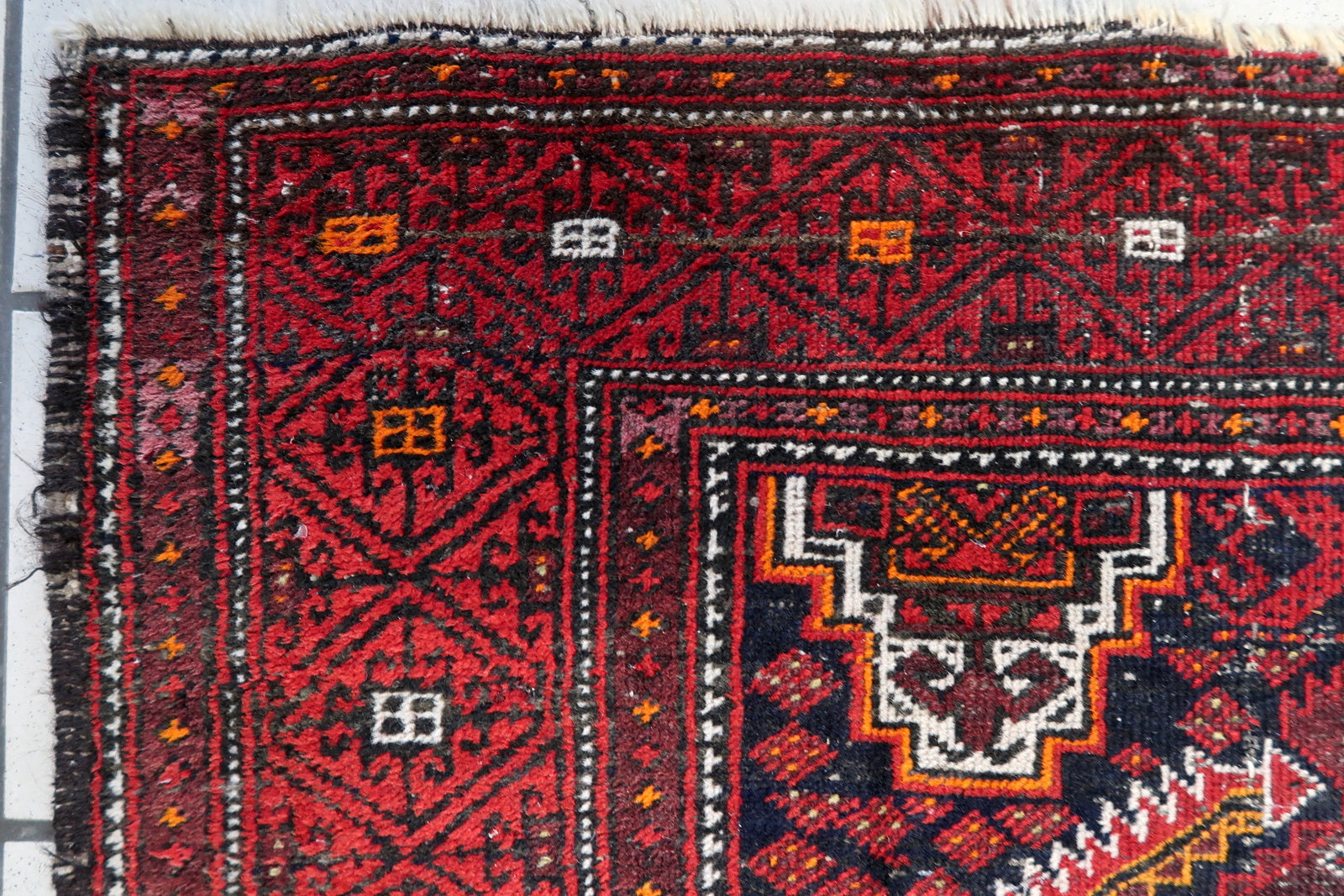 Elongated vintage rug measuring 3.1 x 6 feet, featuring powerful visual contrast and natural wear.

