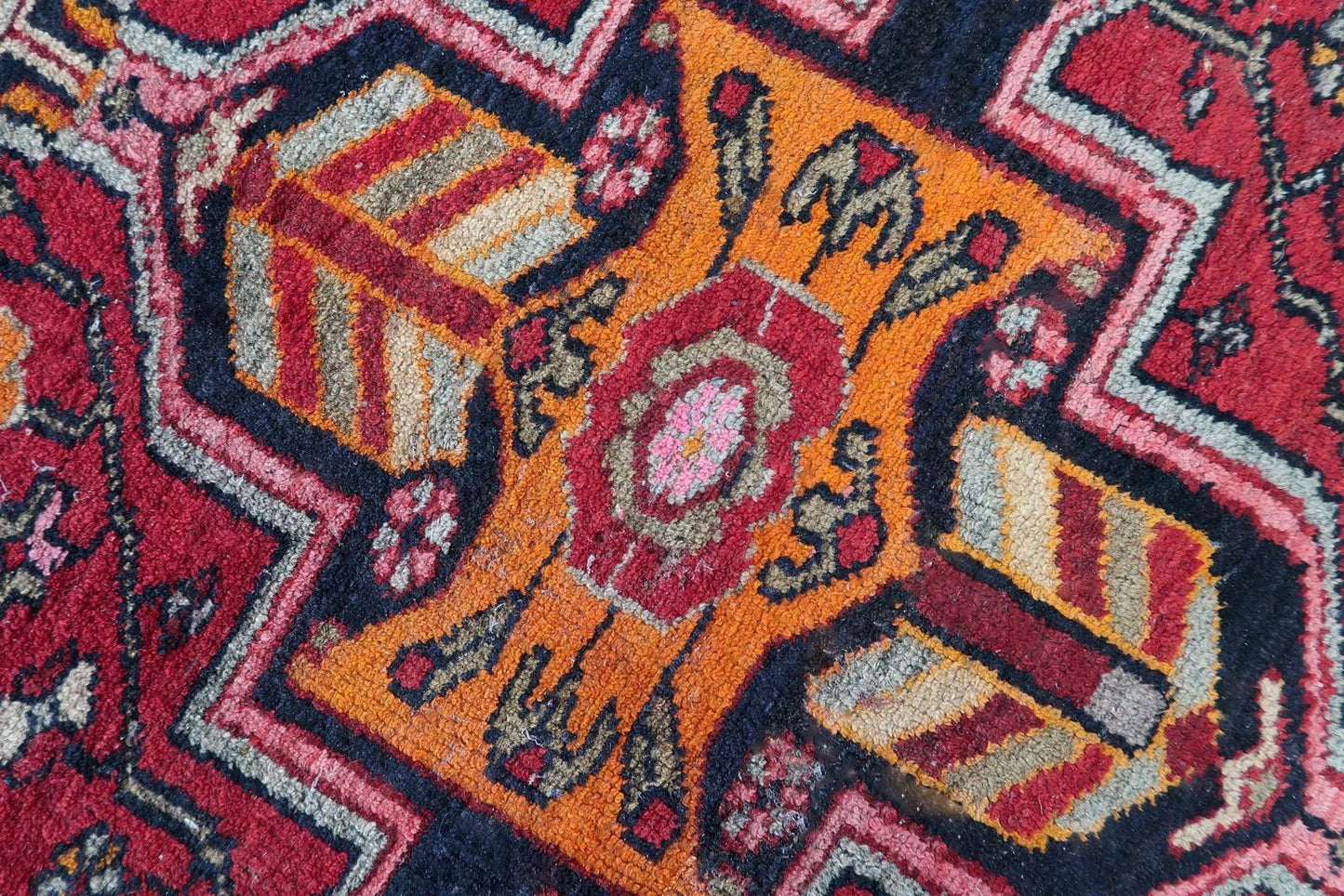 Vibrant antique rug in good condition, showcasing the artistic excellence of Hamadan weavers.

