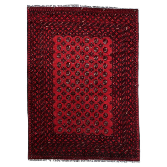 Antique Afghan Ersari rug, 1920s, hand-knotted wool, featuring repeating octagonal guls on a vibrant coral-red ground. 6.8' x 9.4'.

