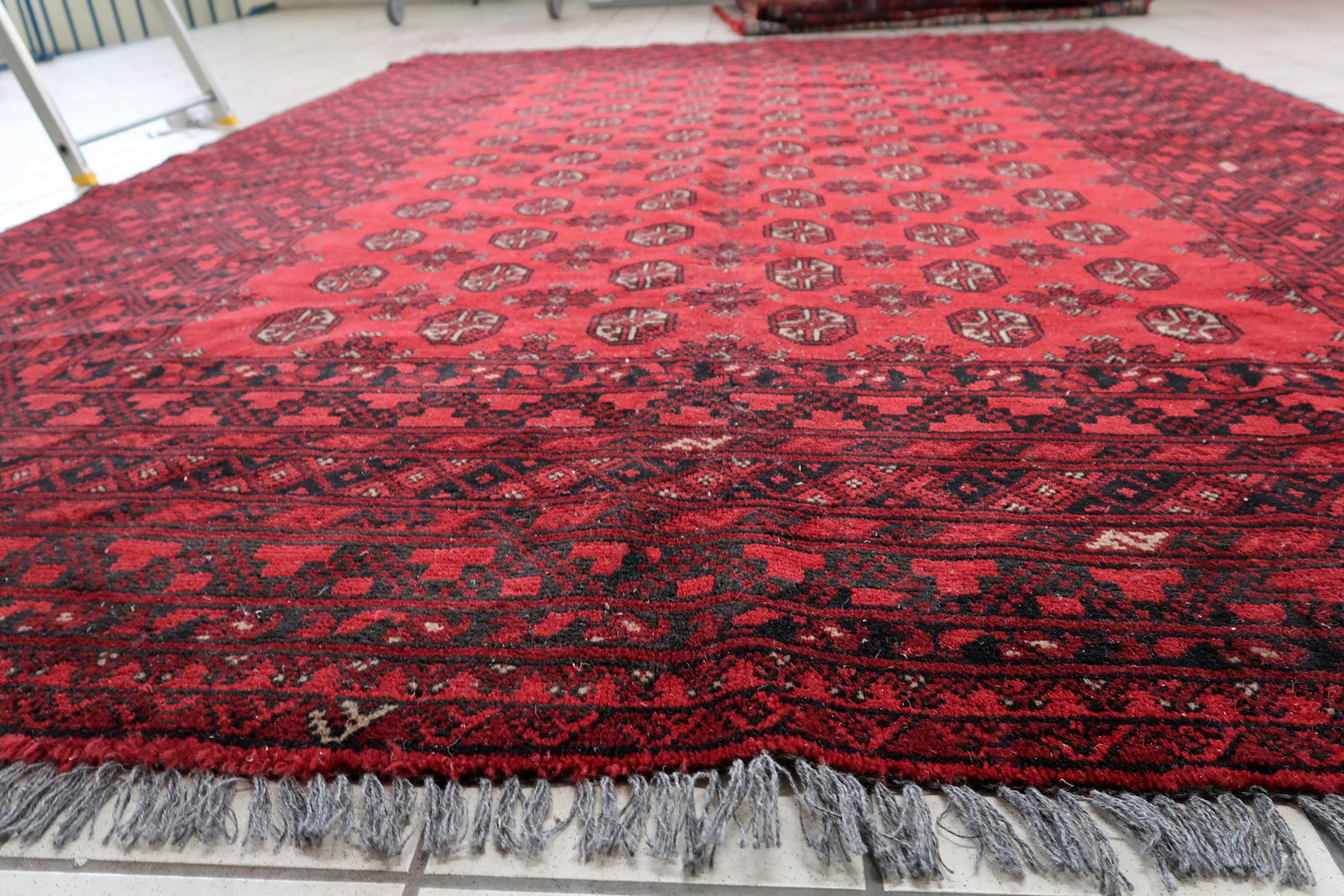 Large antique tribal rug from Afghanistan, 6.8x9.4 ft, geometric pattern.

