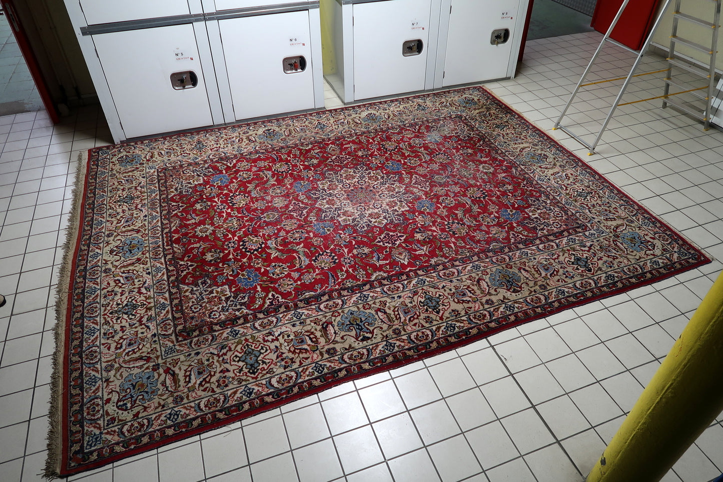 Magnificent antique room-size rug from Tabriz, Persia, showcasing sophisticated artistry with gracefully curving vines, palmettes, and rosettes.

