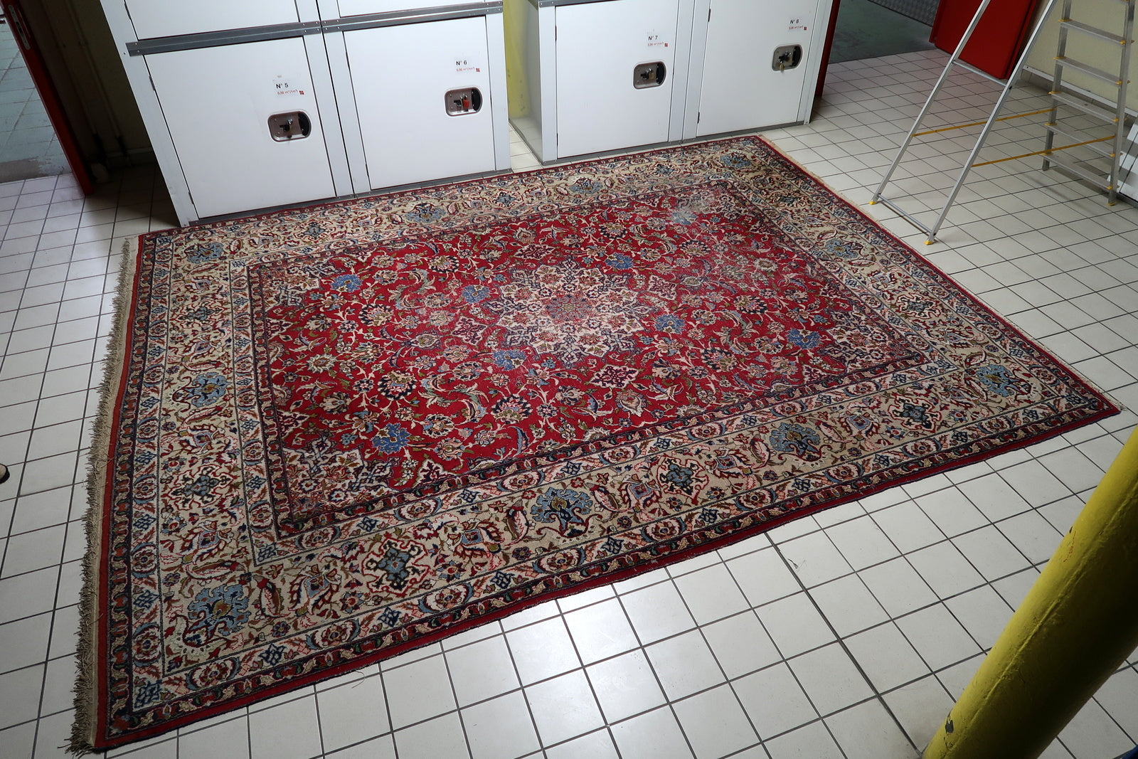 Magnificent antique room-size rug from Tabriz, Persia, showcasing sophisticated artistry with gracefully curving vines, palmettes, and rosettes.

