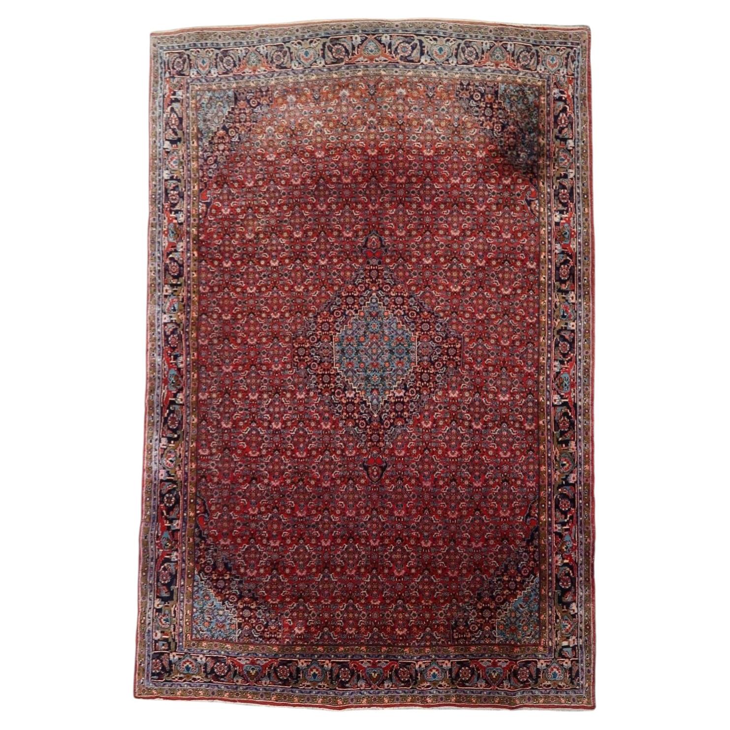 Antique Persian Bidjar "Iron Rug" from the 1920s, hand-knotted wool on cotton, featuring a central diamond medallion. 7.5' x 10.11'.

