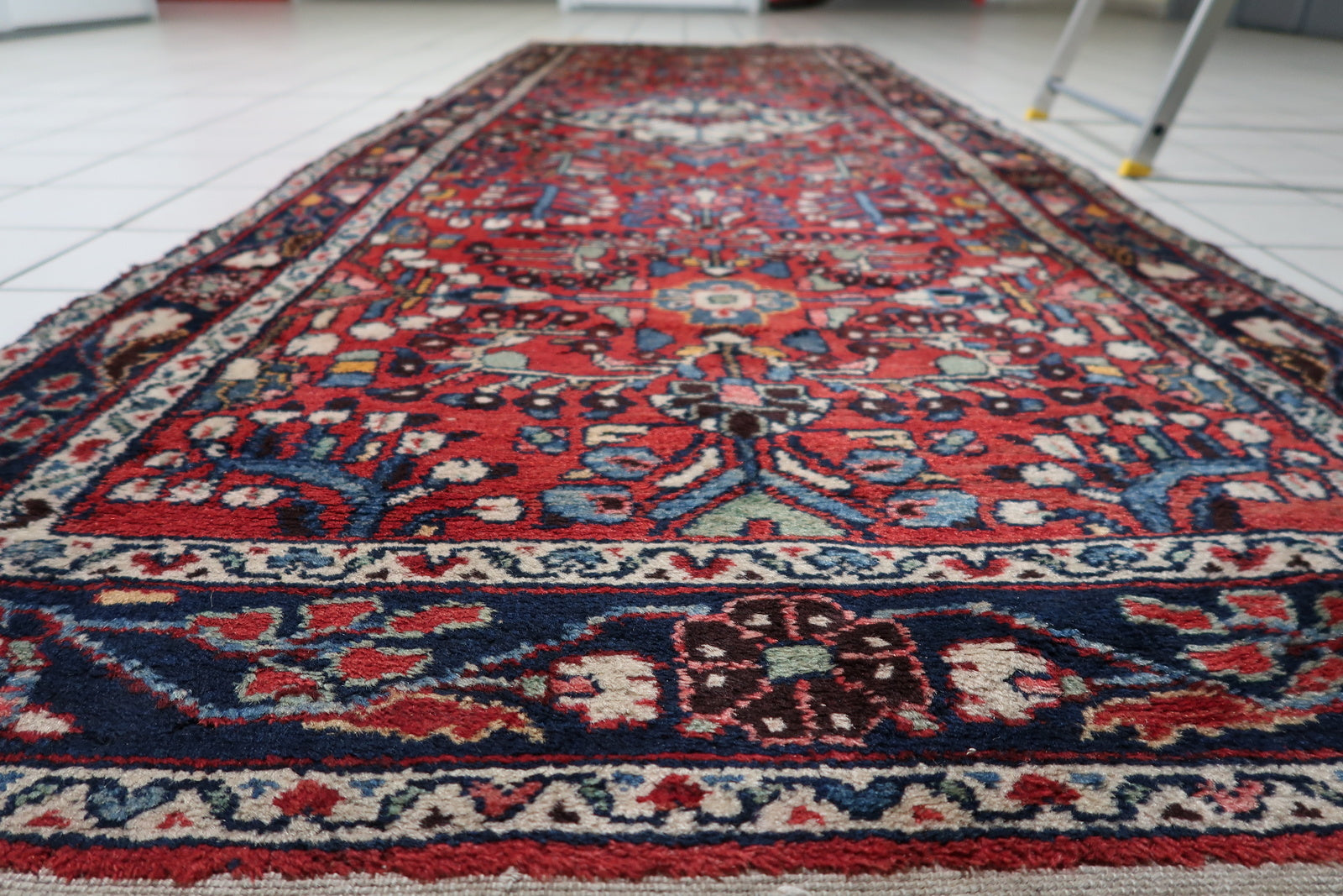 Example of charming hand-made character and lustrous wool on a 100-year-old Persian village runner with areas of low pile.

