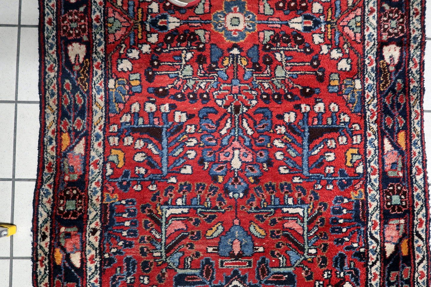 Early 20th century Hamadan carpet runner from Northwest Persia, with midnight blue borders and crisp ivory medallion accents.

