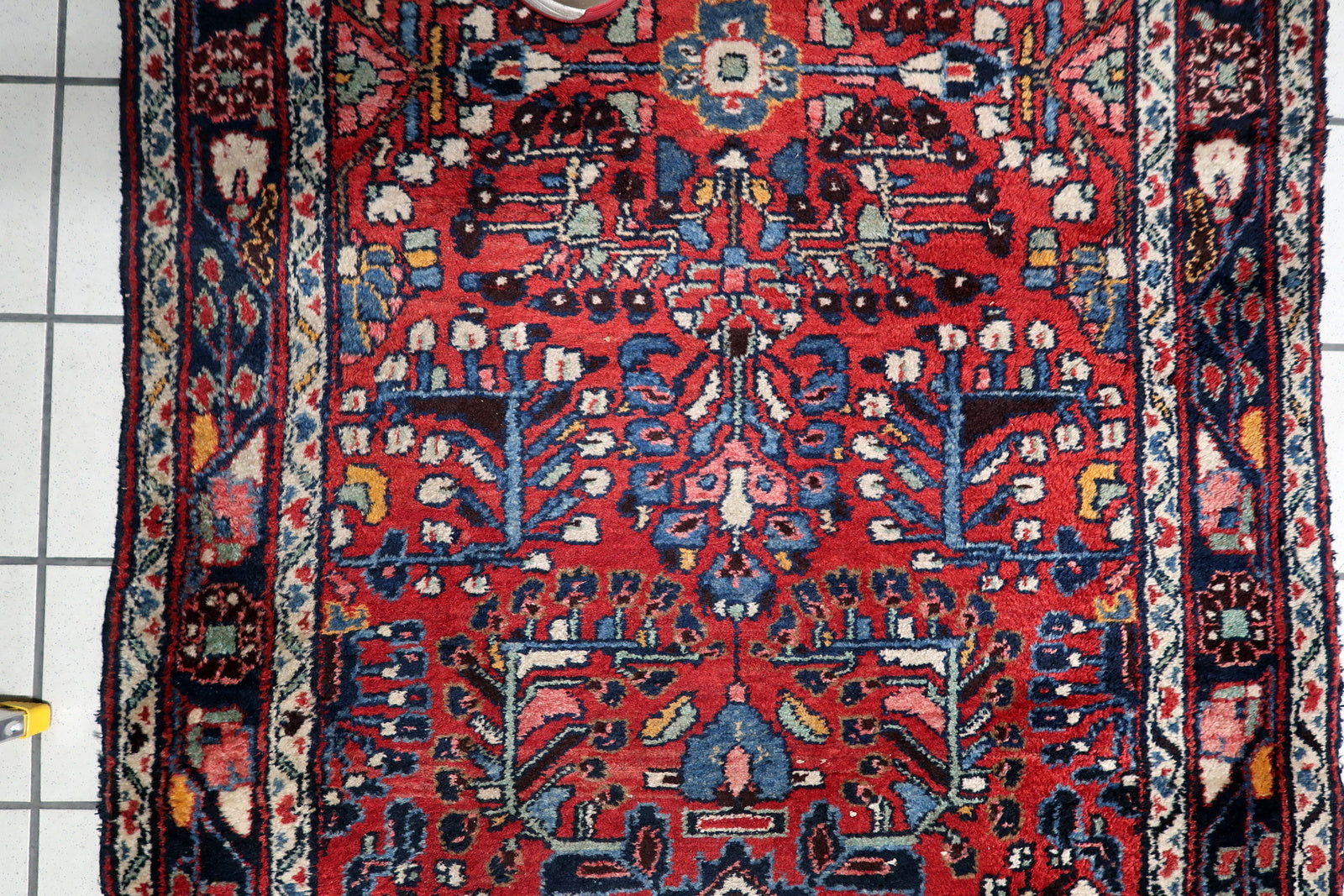 Early 20th century Hamadan carpet runner from Northwest Persia, with midnight blue borders and crisp ivory medallion accents.

