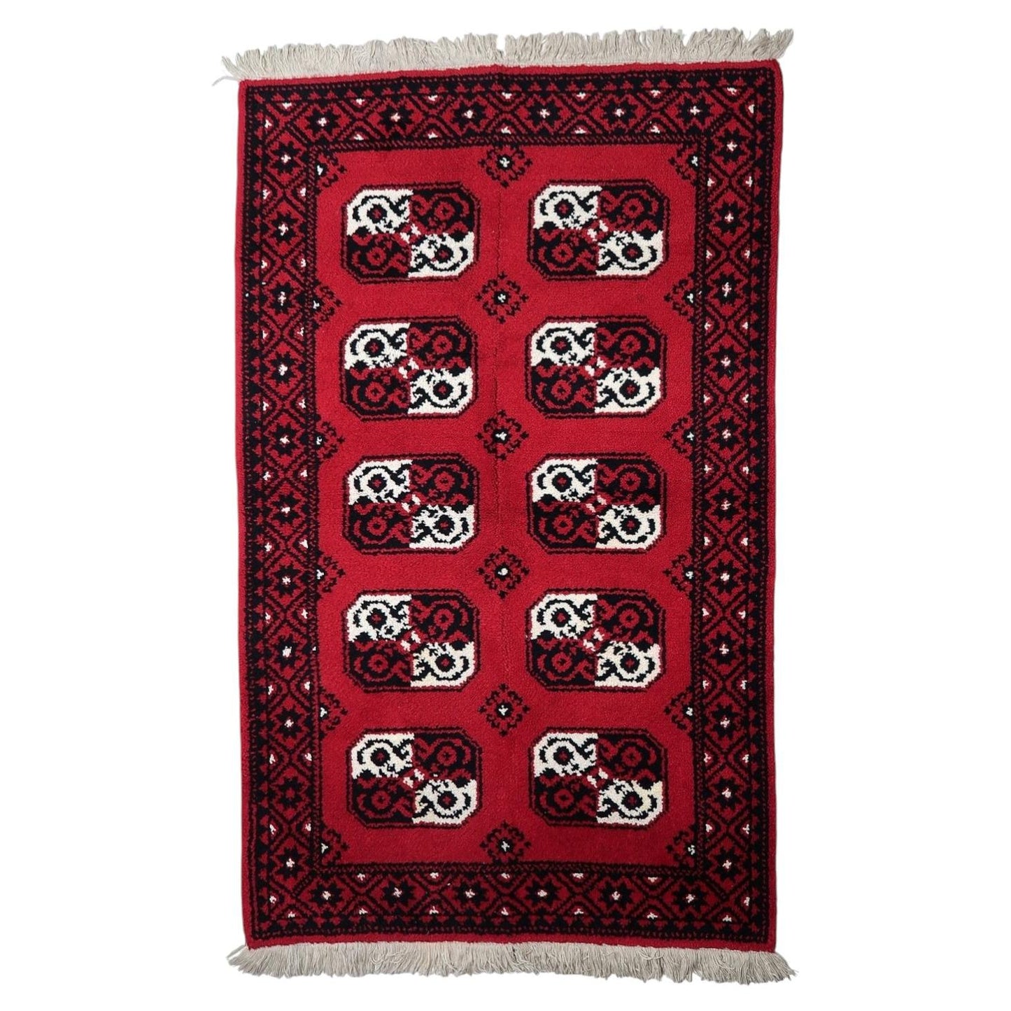 Mid-century French Savonnerie style rug, circa 1950s, hand-knotted wool featuring graphic octagonal medallions on a scarlet-red field. 144 x 230 cm.

