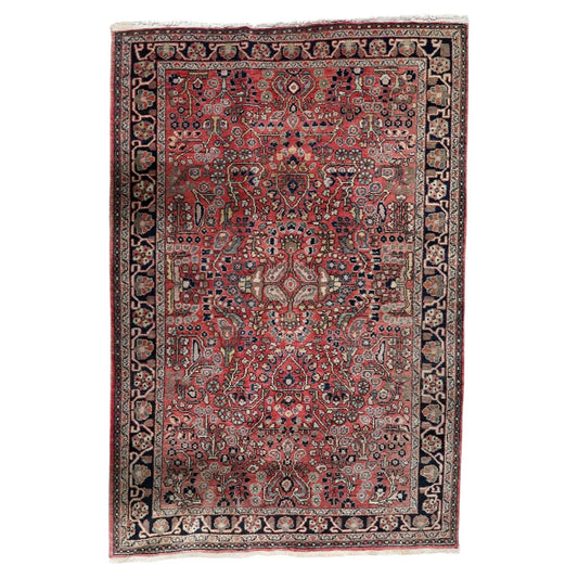 Vintage 1950s Persian Hamadan rug, hand-knotted wool on cotton, featuring an all-over Herati (fish) pattern on a vibrant madder-red field. 100 x 150 cm.

